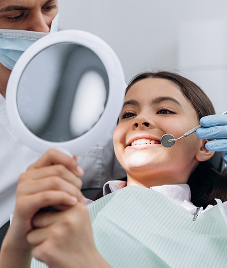 Teen smiling at the dentist