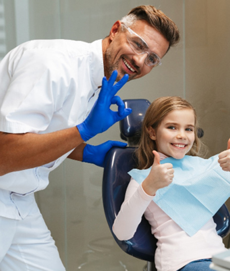 Child smiling in the dental chair