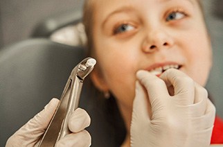 Child having a tooth extracted