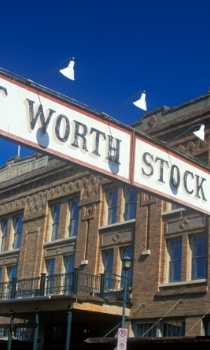 Wooden sign above street for the Fort Worth Stockyards