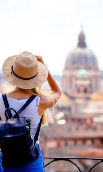 Tourist taking picture of historic building