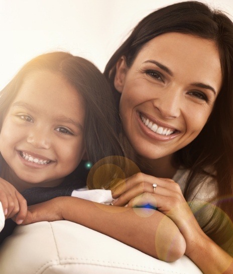 Smiling mother and daughter