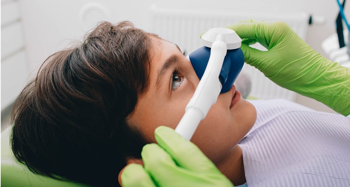 Young boy wearing nitrous oxide sedation dentistry mask