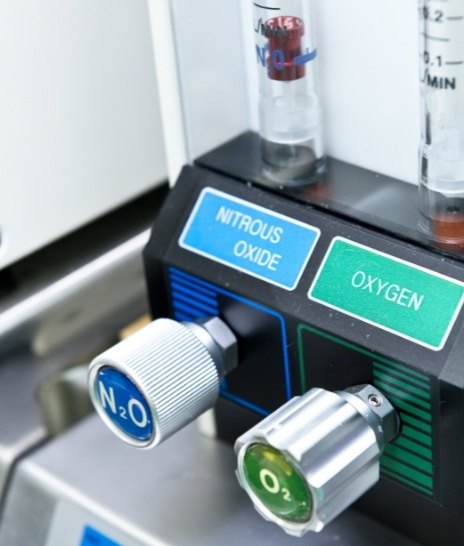 Buttons on machine in dental office that read nitrous oxide and oxygen